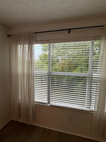 a view of a room that has a window in it