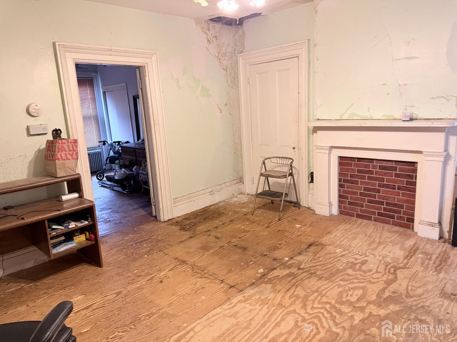 41 Atlantic Street Keyport, NJ 07735 - Photo 20 of 48 a view of a livingroom with furniture and a fireplace