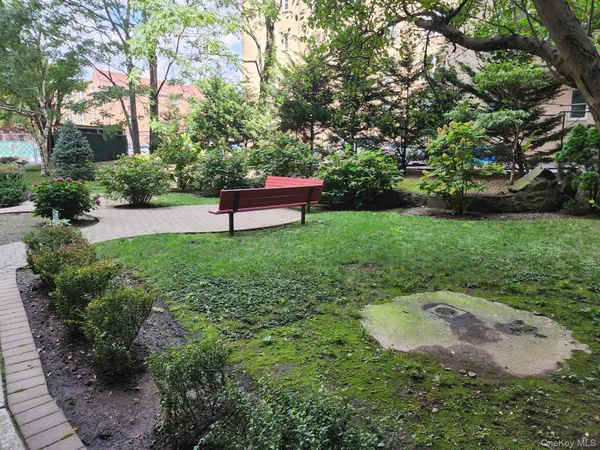 a garden view with a seating space
