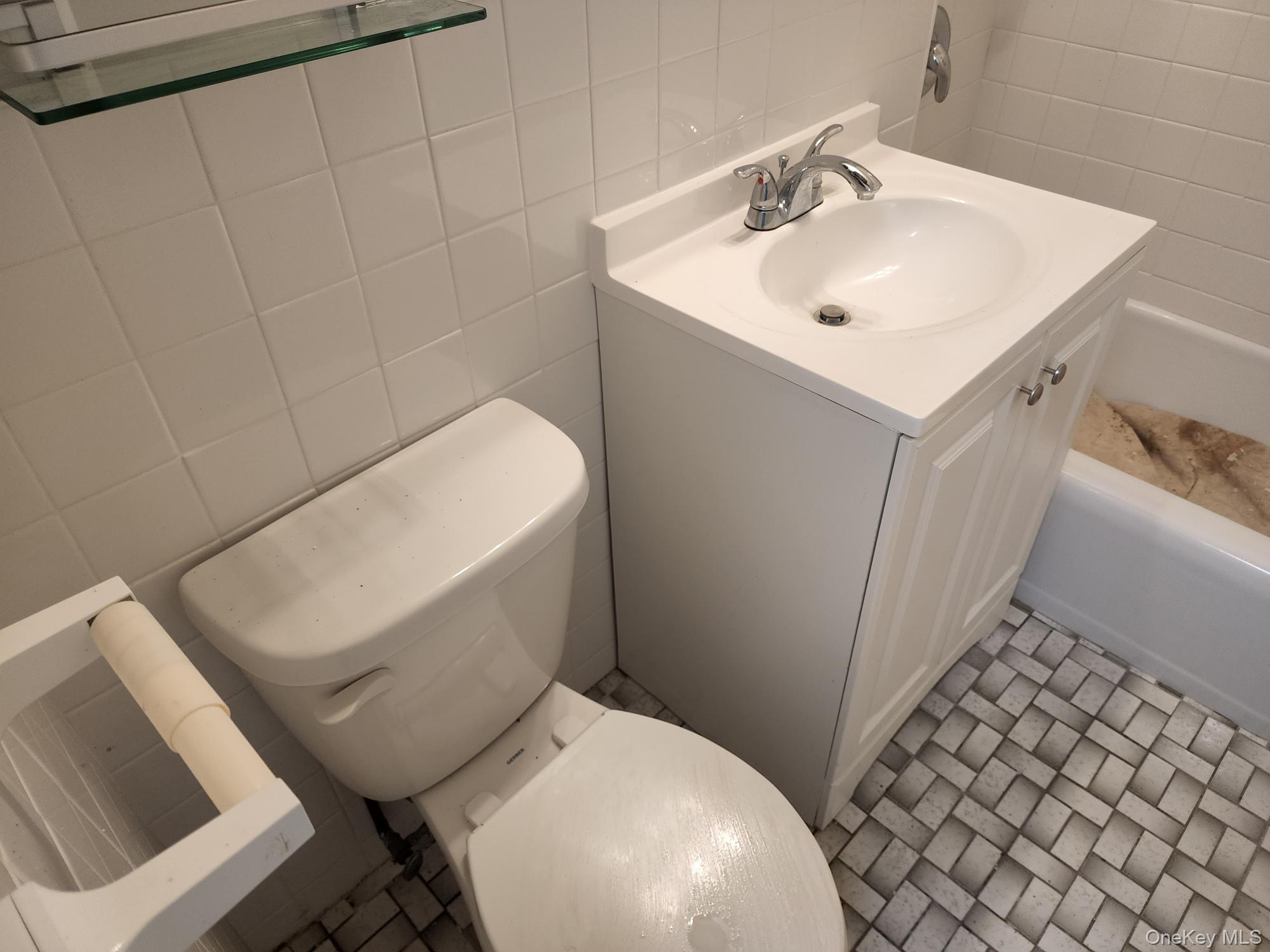 61-35 98th Street, Unit STG Queens, NY 11374 - Photo 10 of 12 a white toilet sitting next to a white sink
