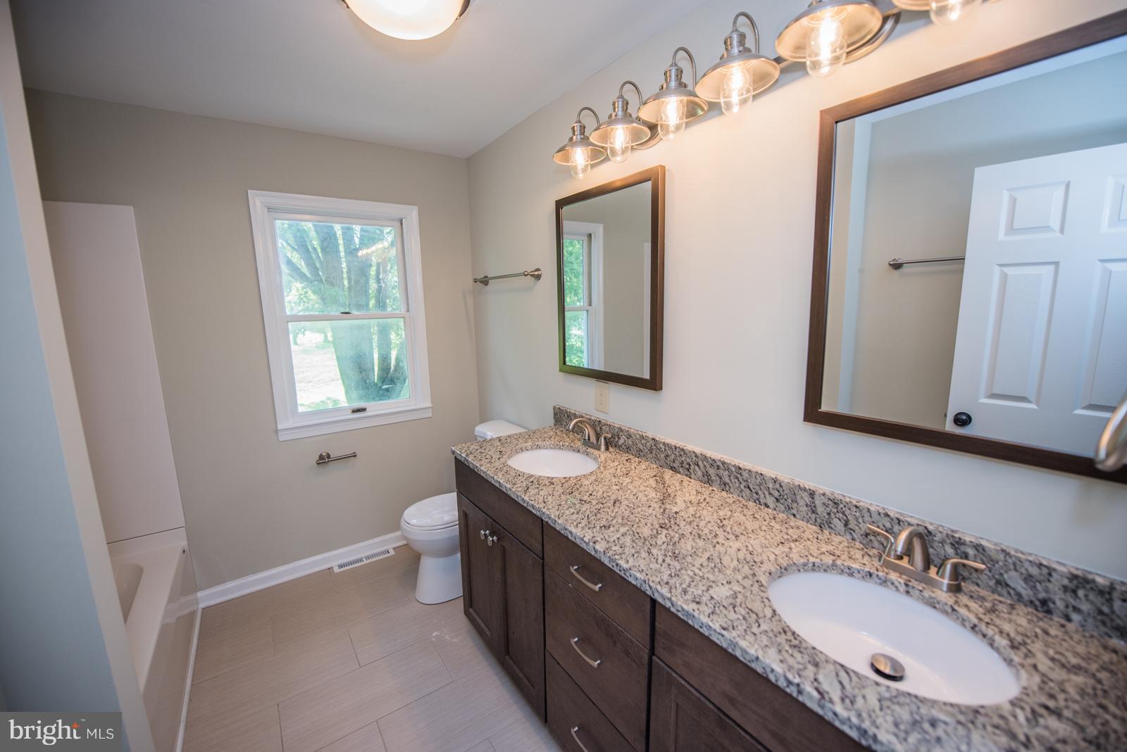 434 Earle Road Charles Town, WV 25414 - Photo 22 of 29 2nd full upper bath with double vanity