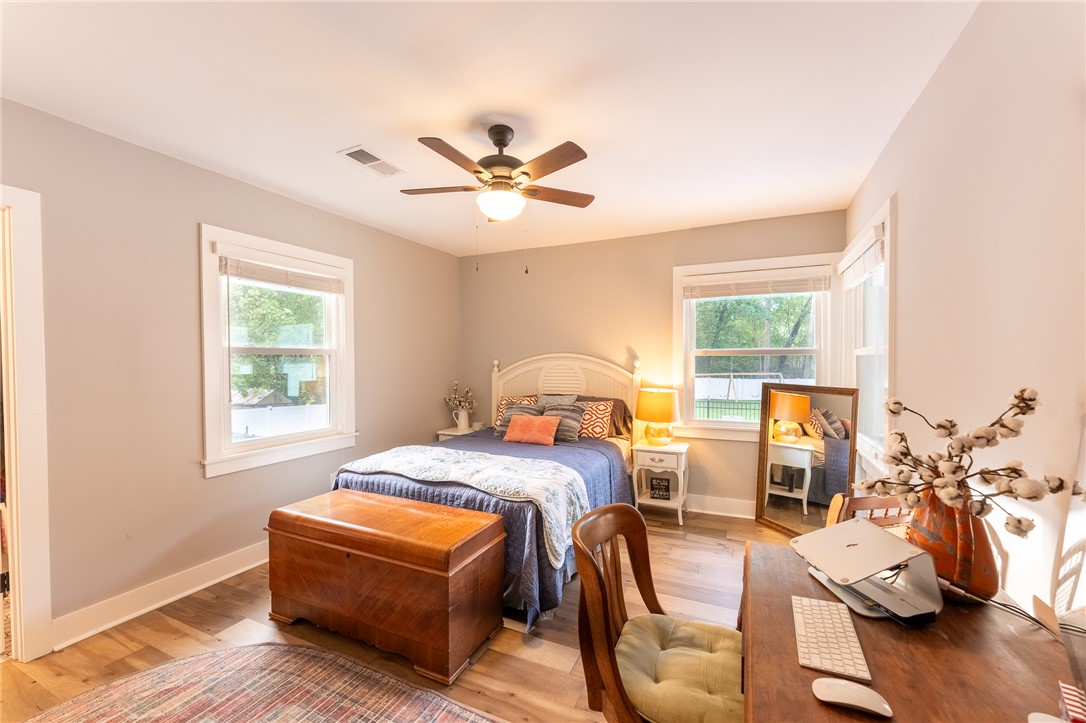 103 Riggs Drive Clemson, SC 29631 - Photo 23 of 50 Hardwood floors and generous windows elevate this comfortable bedroom space.