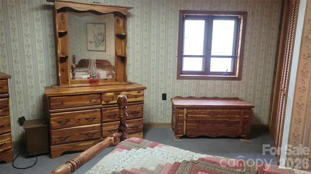 a view of room with workspace and a window