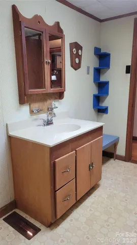 a view of an empty room with a fireplace