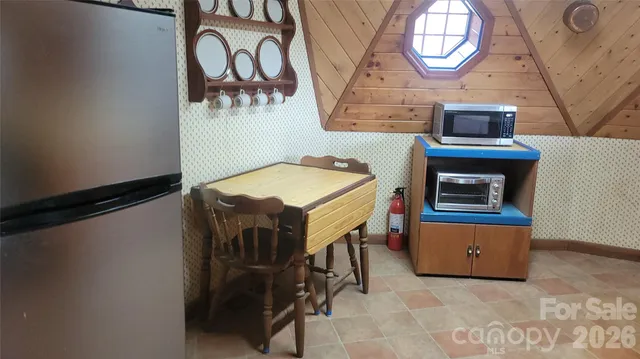 a stove top oven sitting inside of a kitchen