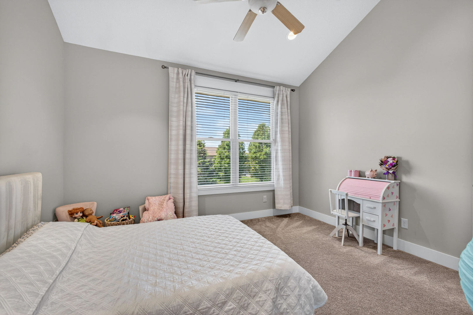 5700 Emily Road Bettendorf, IA 52722 - Photo 26 of 58 a bedroom with a bed and a window