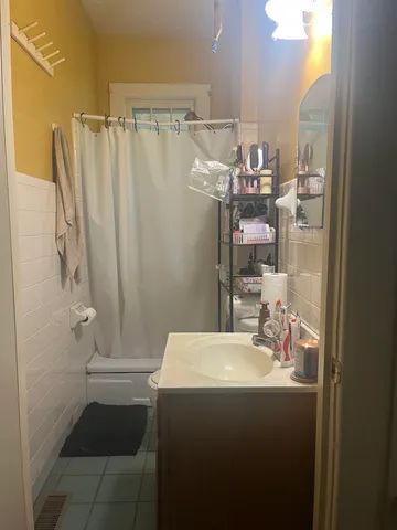 a bathroom with a sink and mirror