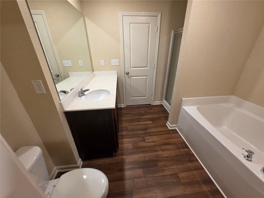 899 Independence Avenue Pendergrass, GA 30567 - Photo 12 of 16 a bathroom with a sink a toilet a tub and view