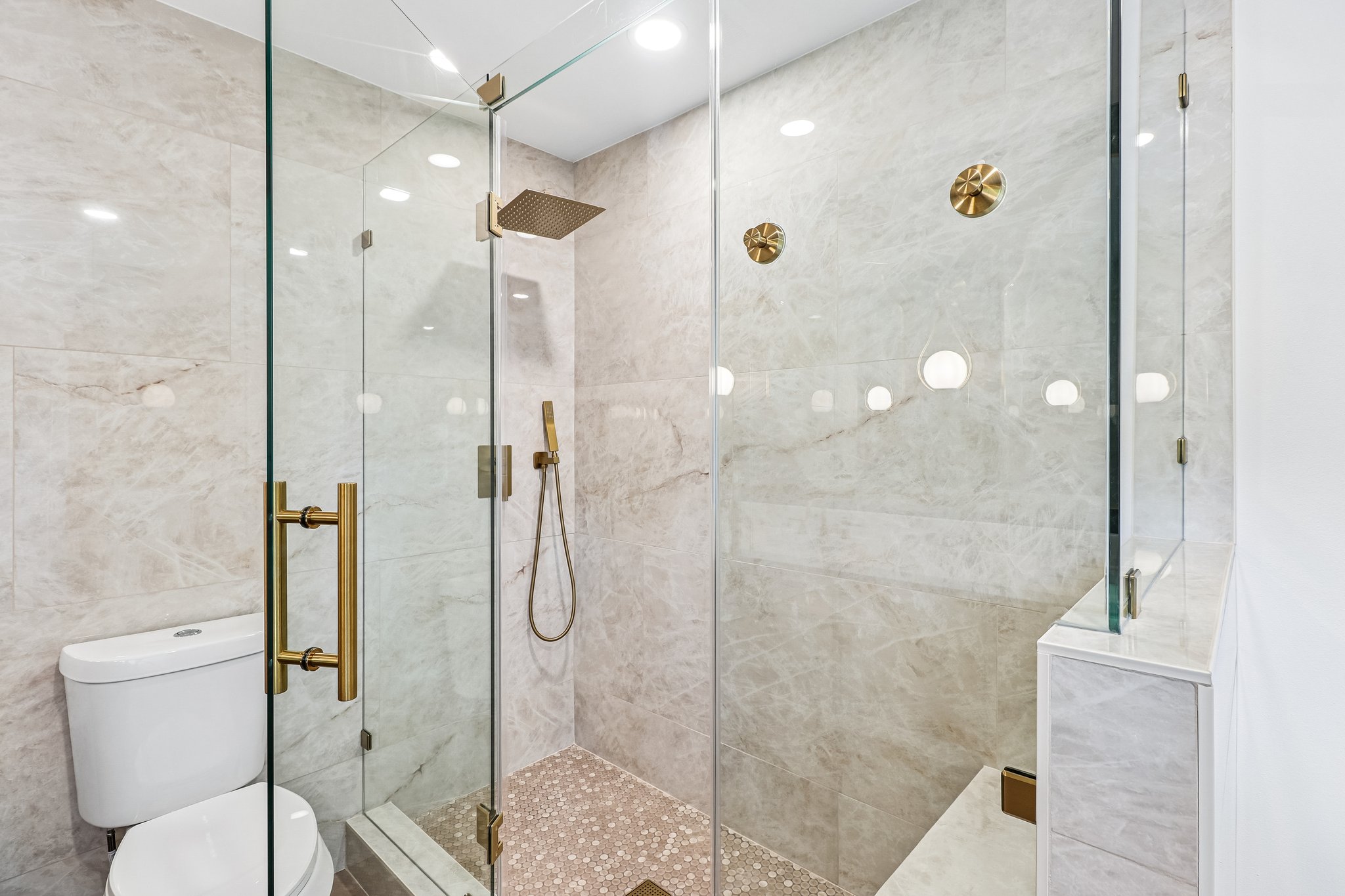 11809 Charing Cross Road Austin, TX 78759 - Photo 16 of 34 Indulge in a luxurious walk-in shower with sleek glass enclosure and rain shower head.