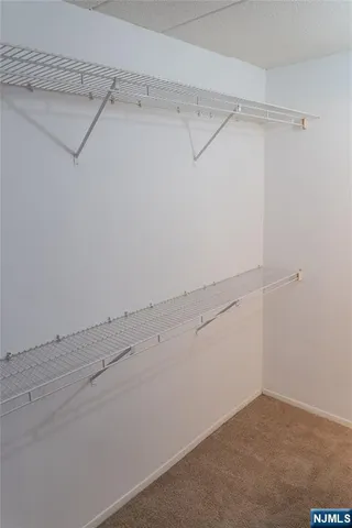a view of an empty walk in closet