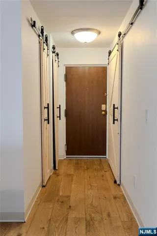 a bathroom with a shower and a glass door