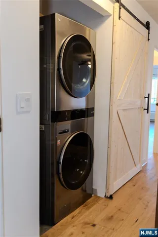 a view of a hallway with washer and dryer