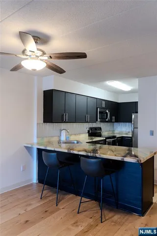a kitchen with a table and chairs in it