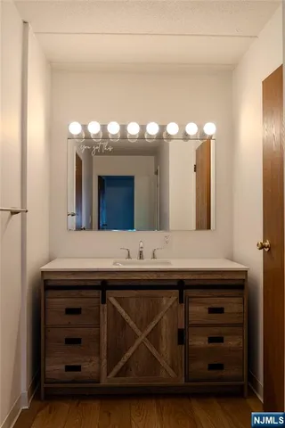 a bathroom with a sink and a mirror