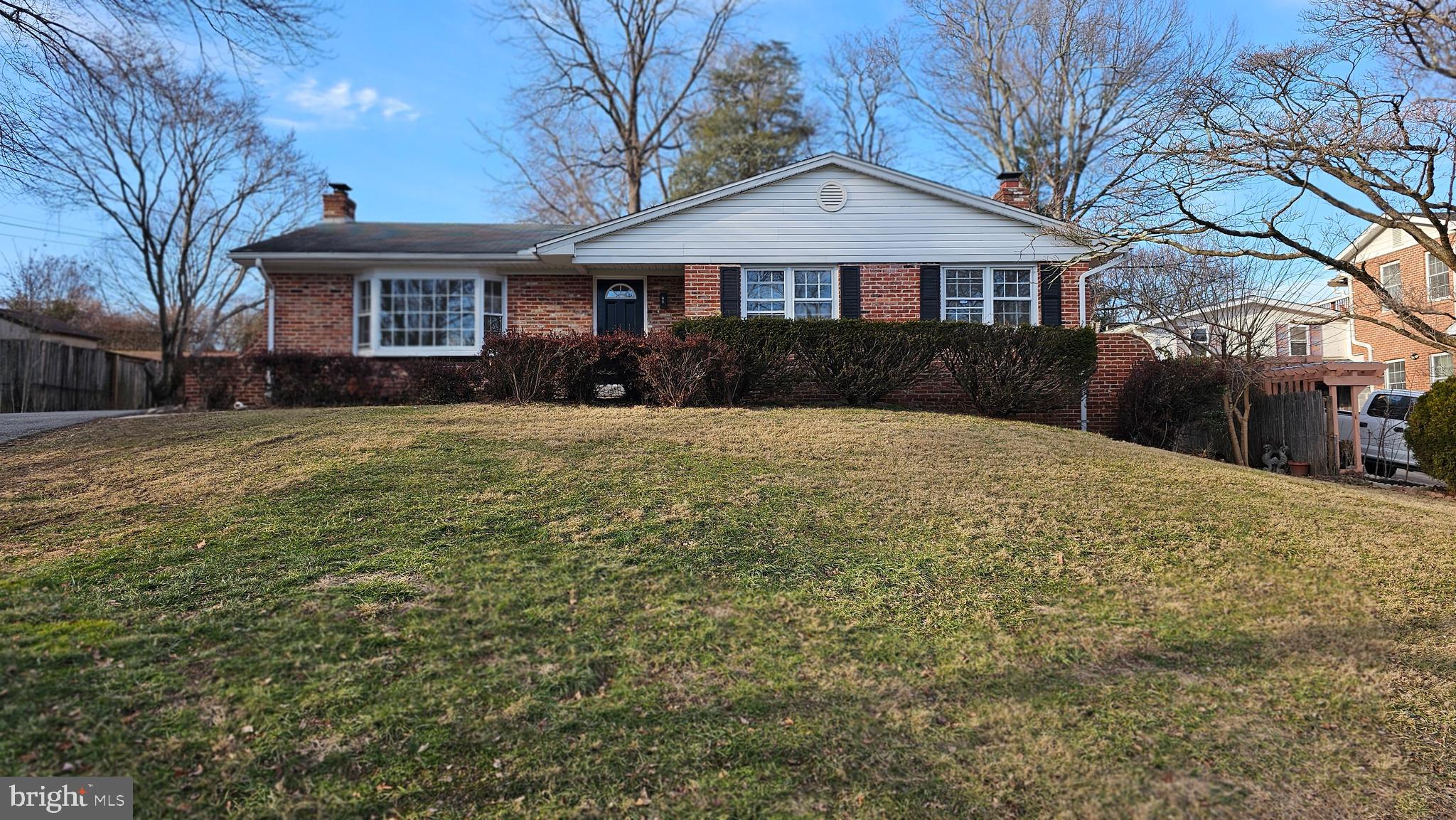 1014 Nora Drive Silver Spring, MD 20904 - Photo 1 of 23 a front view of a house with a yard and garage