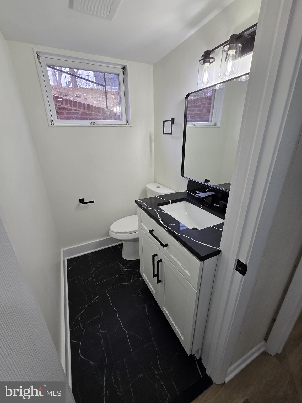 1014 Nora Drive Silver Spring, MD 20904 - Photo 21 of 23 a bathroom with a sink and a mirror
