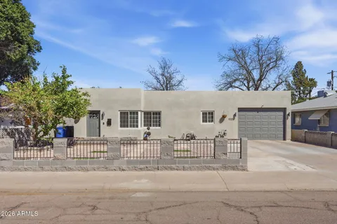 front view of a house with a street