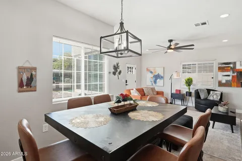 a view of a dining room with furniture window and outside view