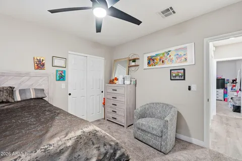 a bedroom with a bed and a cabinets