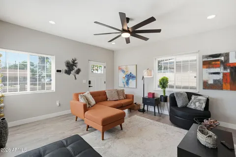a living room with furniture and a window