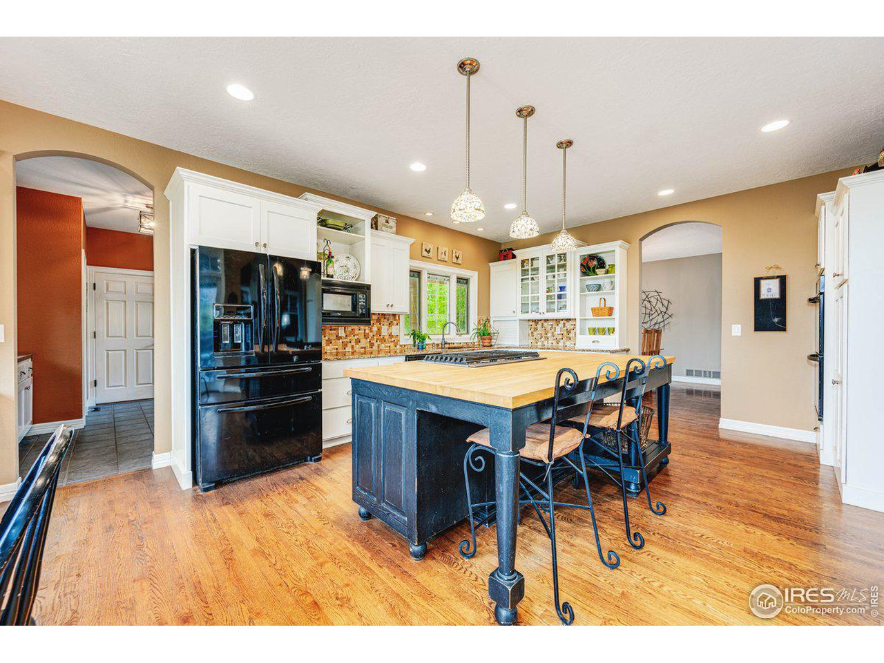 1105 Wyndham Hill Road Fort Collins, CO 80525 - Photo 12 of 40 Chef's Kitchen w/ White Cabinetry