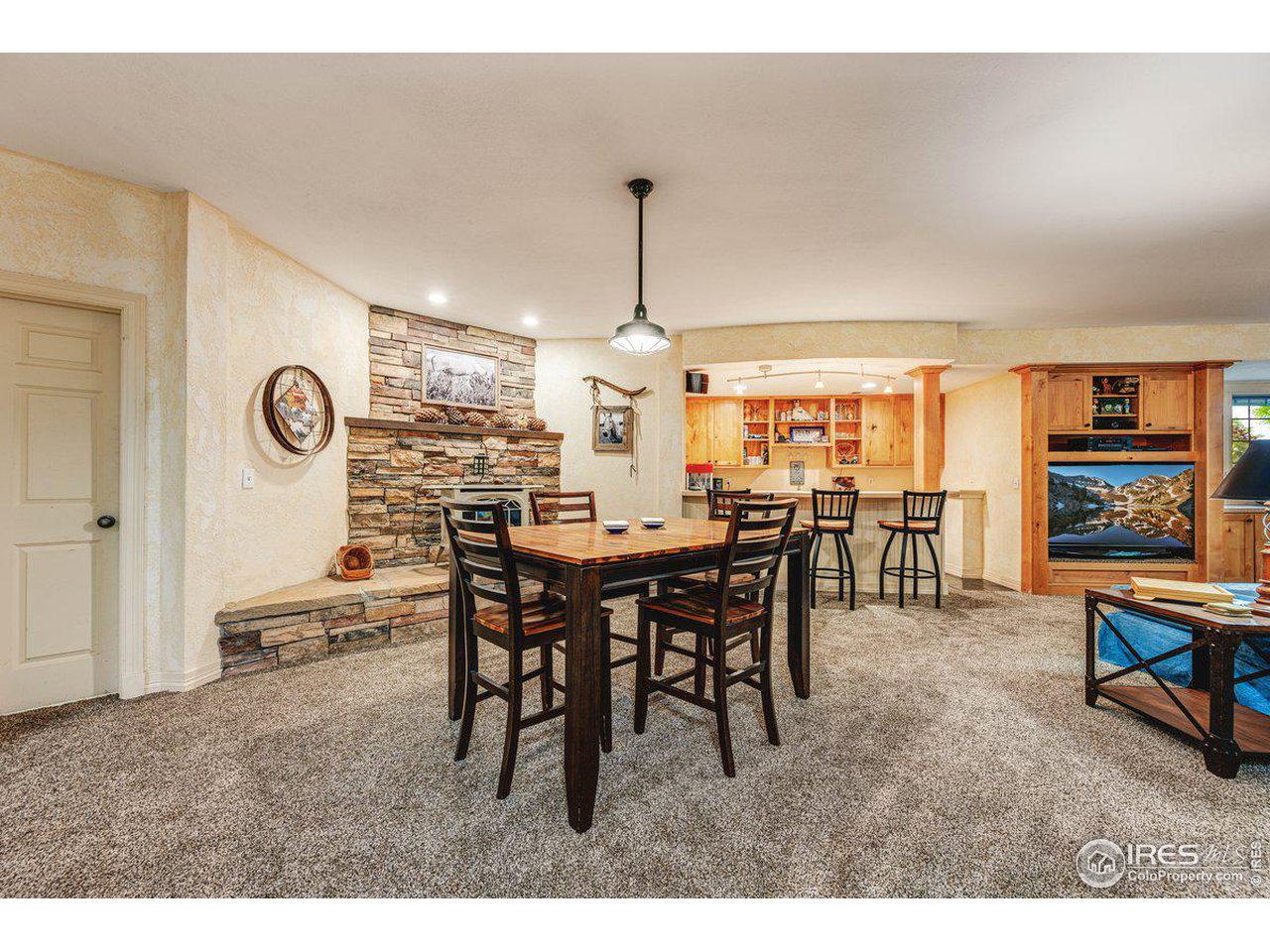 1105 Wyndham Hill Road Fort Collins, CO 80525 - Photo 29 of 40 Massive Rec Room w/ Stone Fireplace