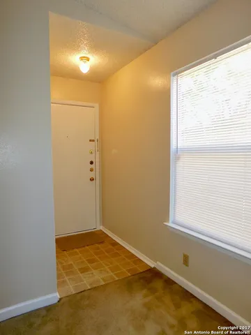 a view of a room with a window