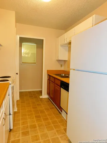 a view of a kitchen with a sink