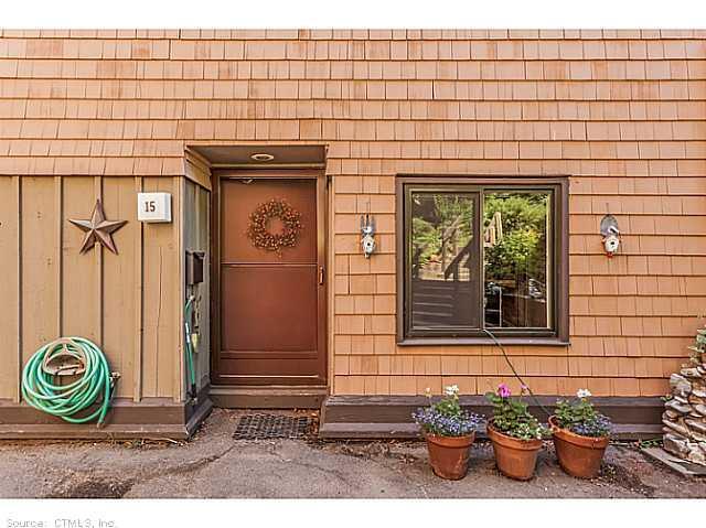 15 Orange Road, Unit 15 Middletown, CT 06457 - Photo 1 of 1 a front view of a house with a garden
