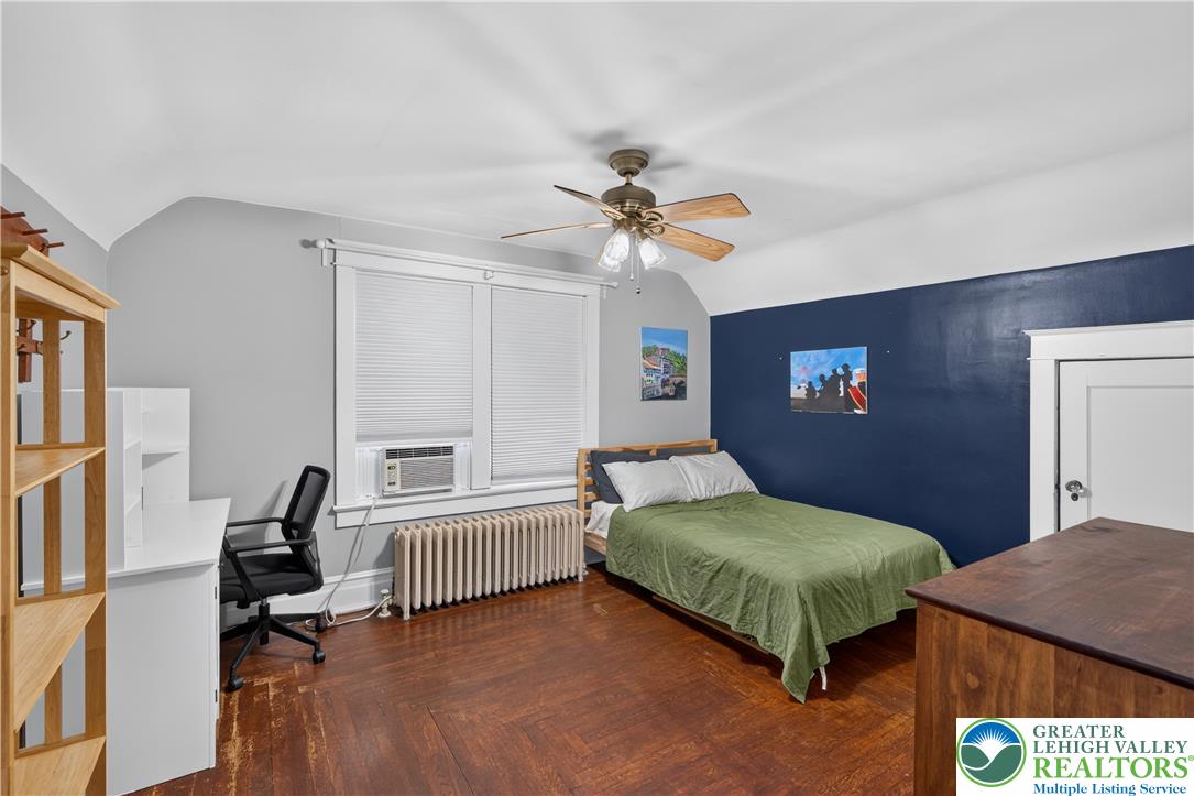 534 Ridge Street Emmaus, PA 18049 - Photo 30 of 40 a bedroom with a bed and a chandelier