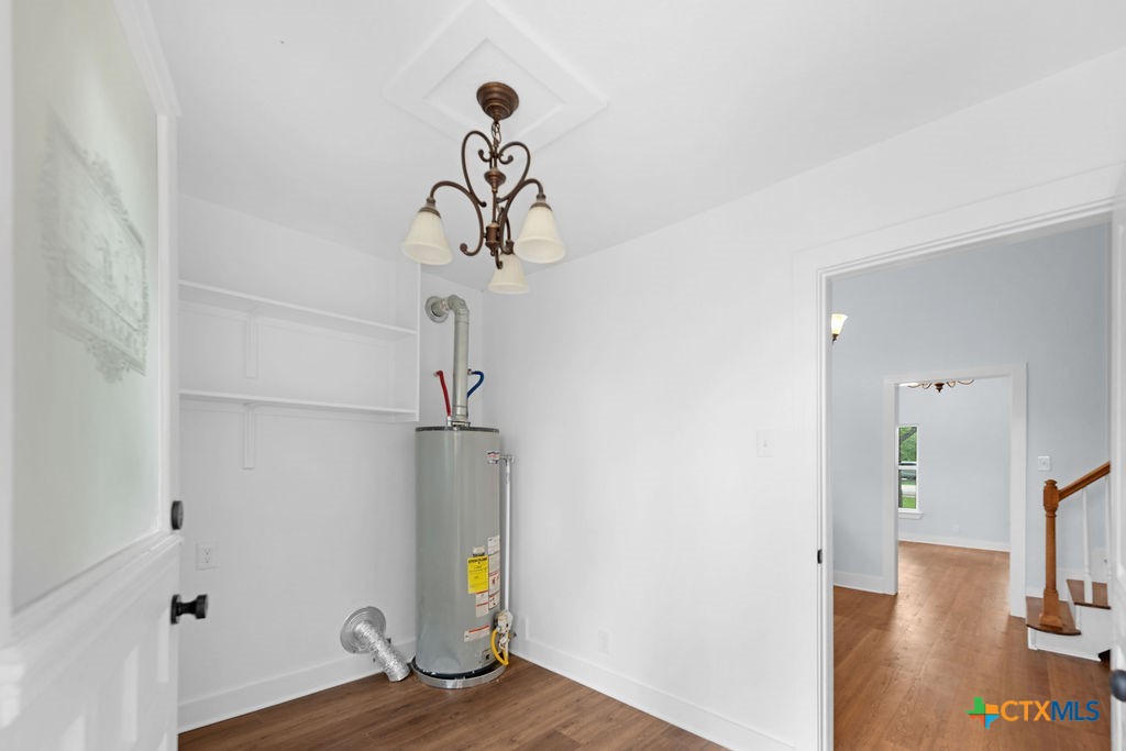 607 West 3rd Street Eddy, TX 76524 - Photo 21 of 29 a view of a room with a wooden floor and entryway