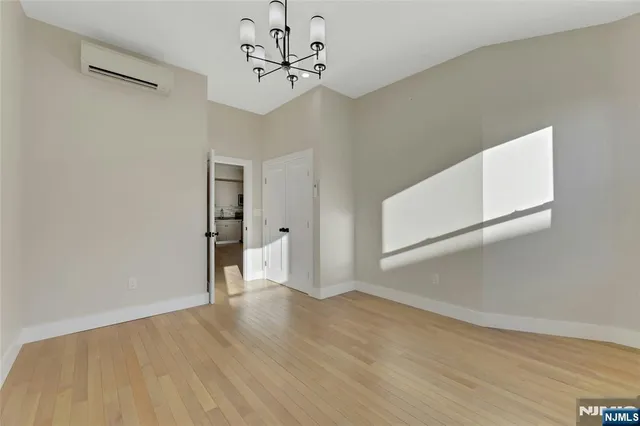 a white toilet sitting next to a shower