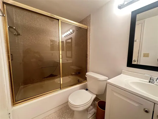 a bathroom with a sink and a large mirror