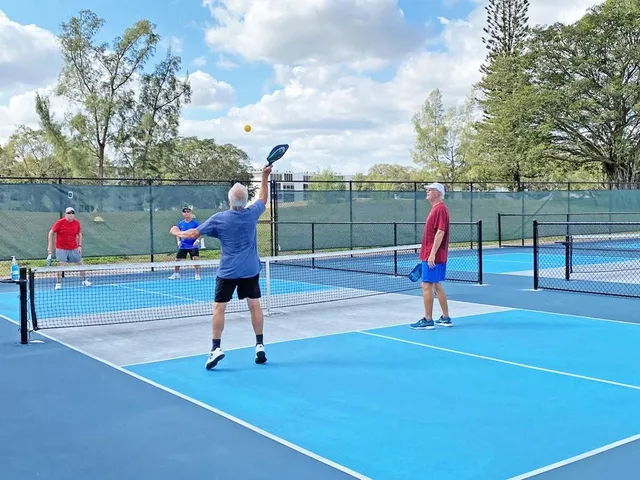 a living room with furniture and a refrigerator