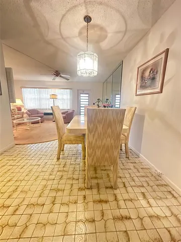 a bedroom with a bed and a view of kitchen