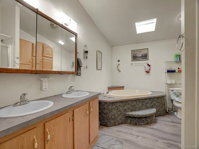 a en suite bathroom with a sink and a mirror