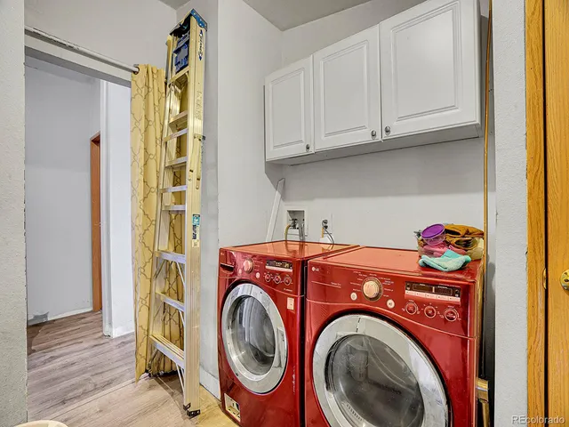 a living room with furniture and a lamp