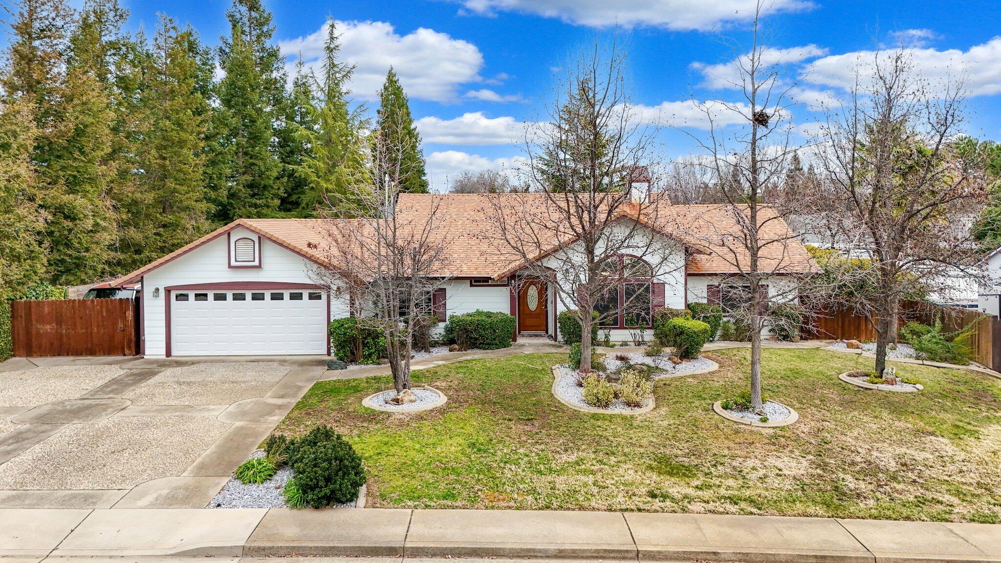 19271 Lexington Lane Redding, CA 96003 - Photo 1 of 39 a view of a house with a yard and trees