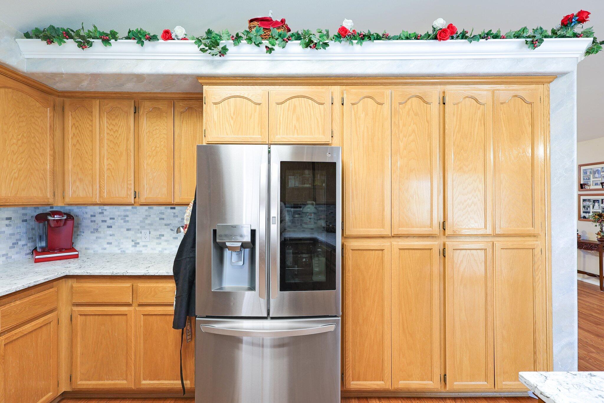 19271 Lexington Lane Redding, CA 96003 - Photo 12 of 39 a kitchen with a refrigerator and cabinets