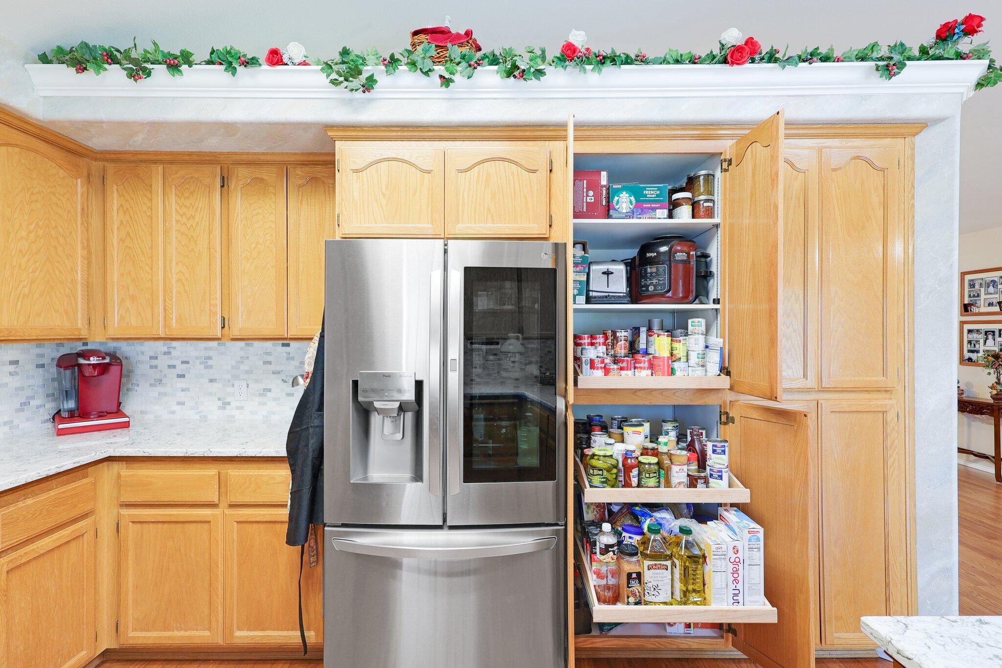 19271 Lexington Lane Redding, CA 96003 - Photo 13 of 39 a kitchen view with a refrigerator and cabinets