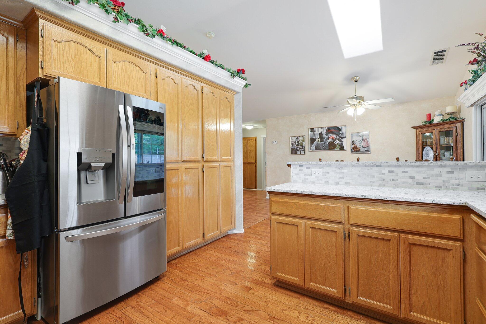19271 Lexington Lane Redding, CA 96003 - Photo 14 of 39 a kitchen with stainless steel appliances a refrigerator and a sink