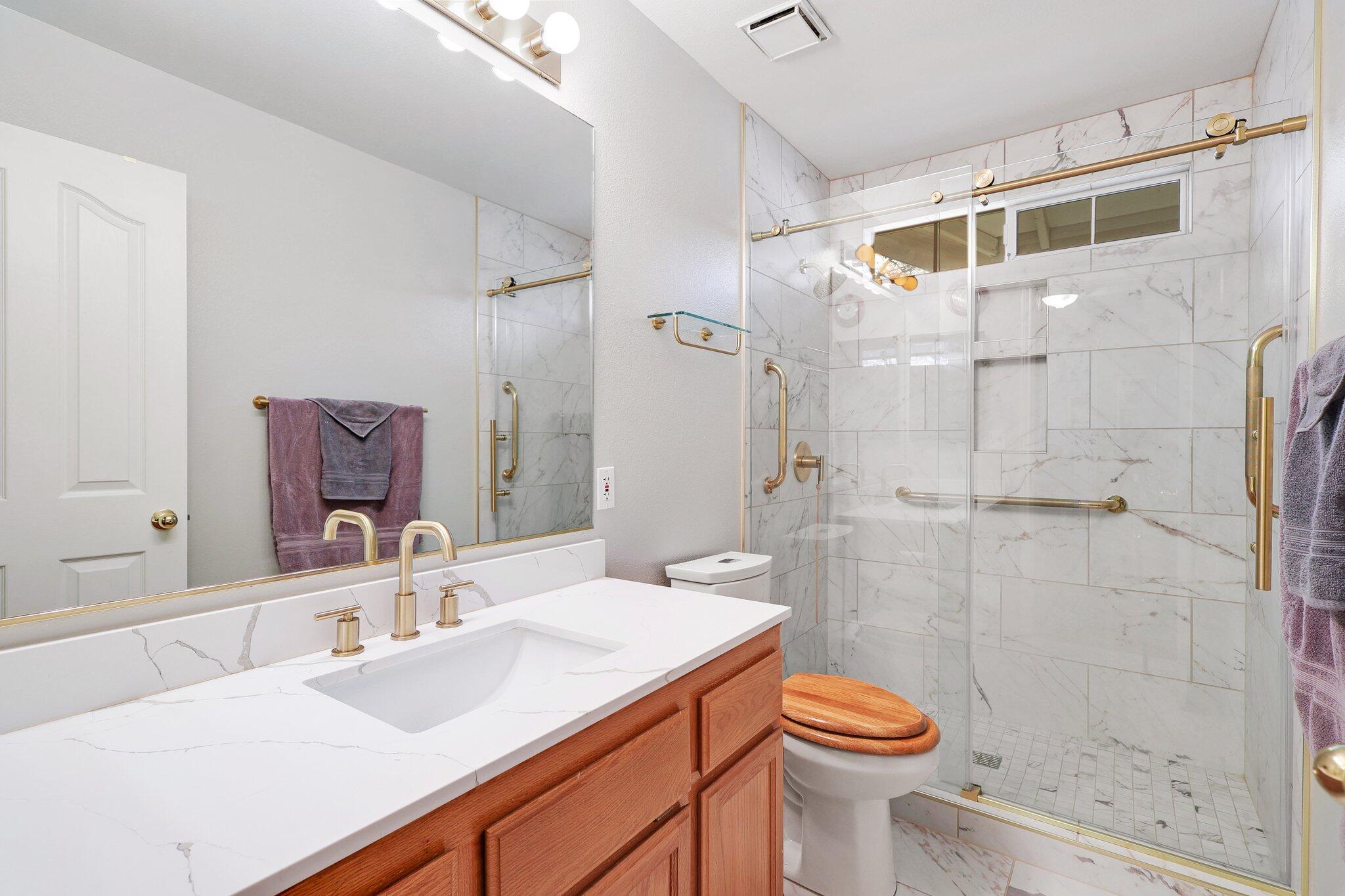 19271 Lexington Lane Redding, CA 96003 - Photo 15 of 39 a bathroom with a sink toilet and shower