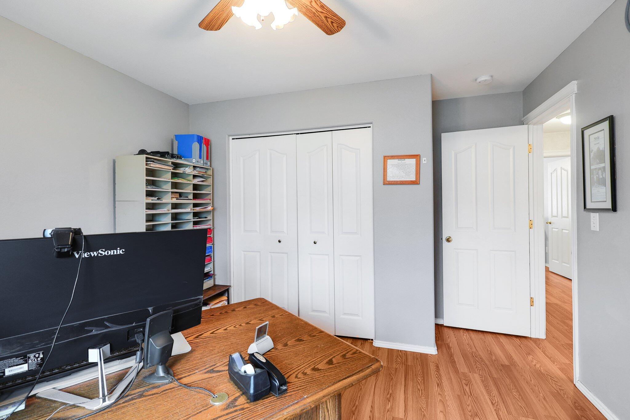 19271 Lexington Lane Redding, CA 96003 - Photo 18 of 39 a bedroom with a bed and a chandelier