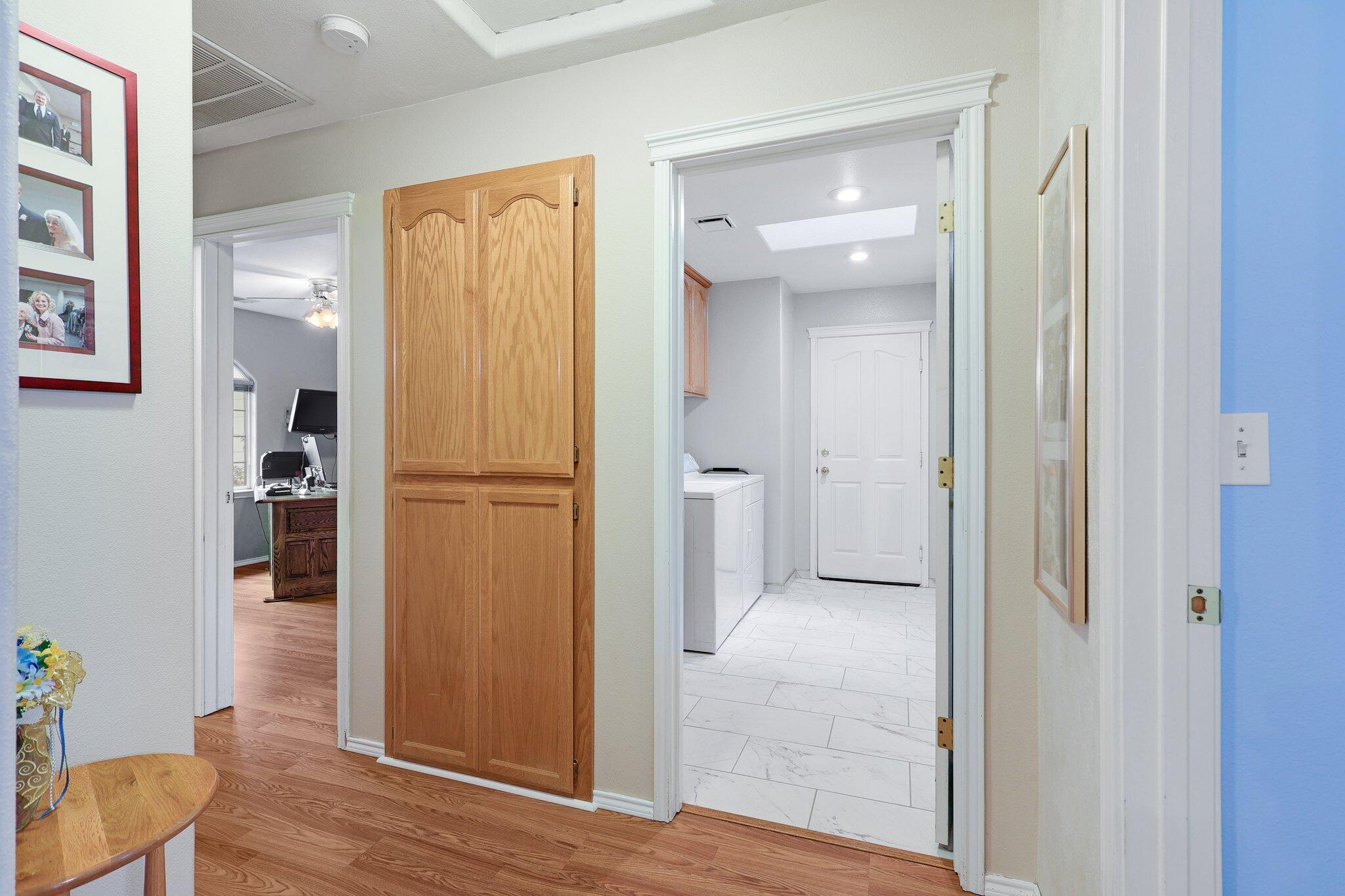 19271 Lexington Lane Redding, CA 96003 - Photo 25 of 39 a view of a hallway with wooden floor and closet area