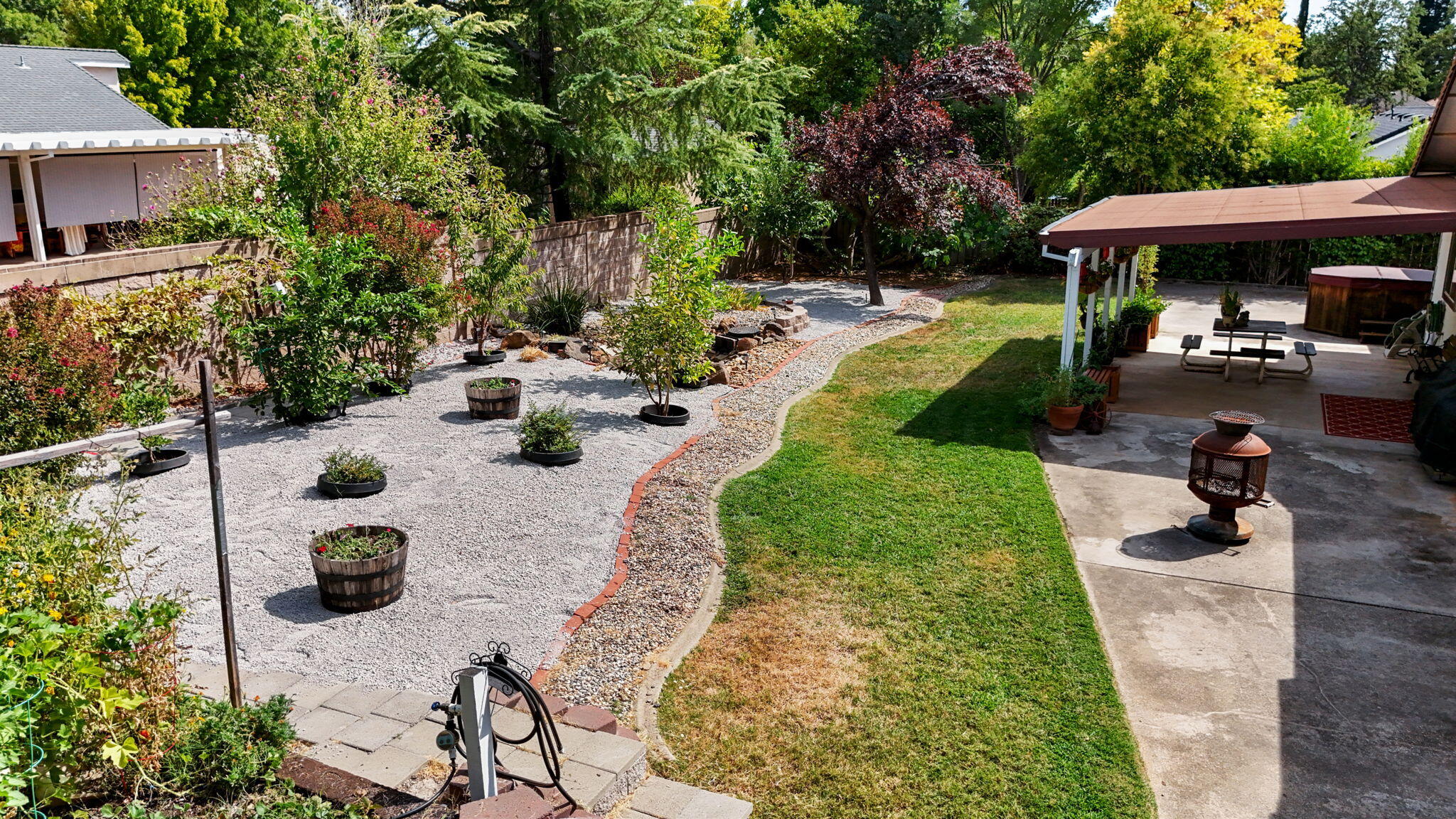 19271 Lexington Lane Redding, CA 96003 - Photo 30 of 39 a view of a backyard with table and chairs