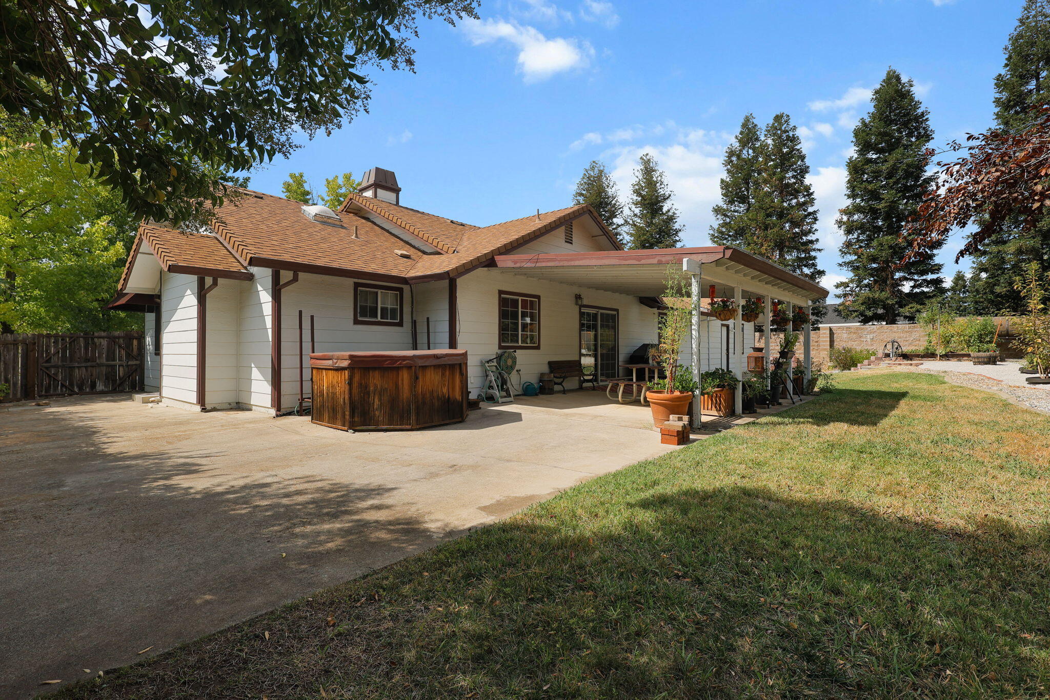 19271 Lexington Lane Redding, CA 96003 - Photo 34 of 39 a view of a house with backyard and porch