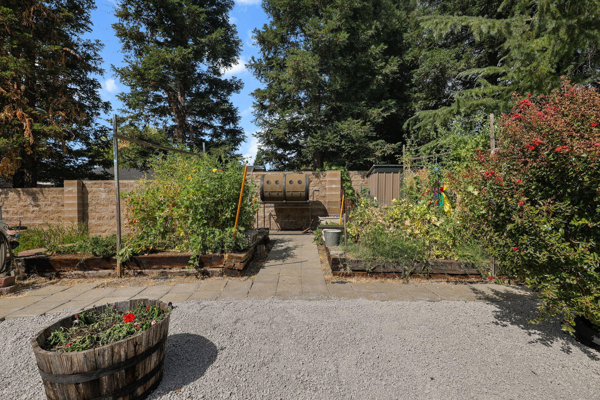 19271 Lexington Lane Redding, CA 96003 - Photo 35 of 39 a view of a patio with couches and a table and chairs under an umbrella