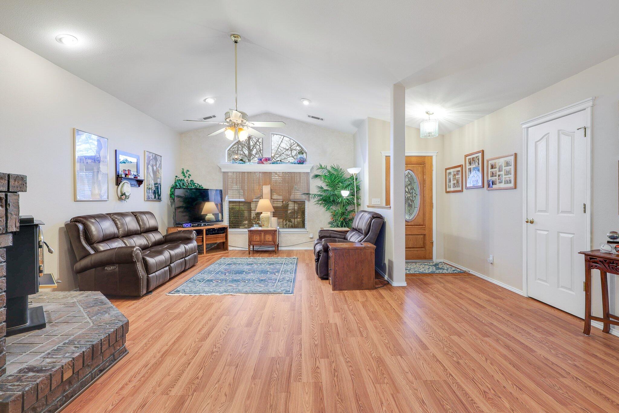 19271 Lexington Lane Redding, CA 96003 - Photo 7 of 39 a living room with furniture fireplace and wooden floor