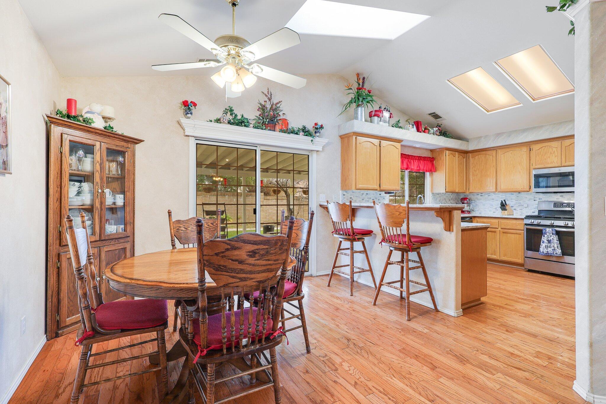 19271 Lexington Lane Redding, CA 96003 - Photo 9 of 39 a view of a dining room with furniture and wooden floor