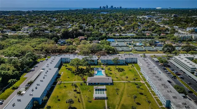 an aerial view of residential houses with outdoor space